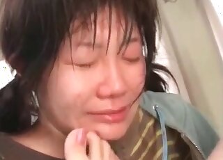 Asian bitch squatting on the table and showing her twat