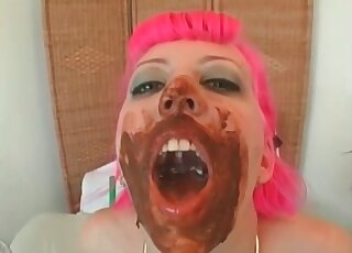 Bitch with pink hair pissing while covered in poop