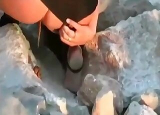 Lara Croft cosplay plays in the outdoors